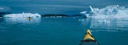 Kayaking among Greenland's icebergs. The word 'kayak' comes from the Greenlandic word 'qajaq." Photo: Greenland Tourism
