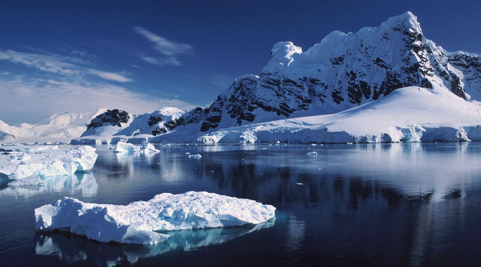 Icebergs and mountains in Antarctica landscape