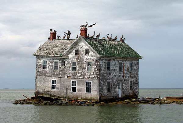 Unusually high rainfall is also a result of rapid climate change. This is the last house on Holland Island, Maryland, after the storms of 2010. ©baldeaglebluff, flickr