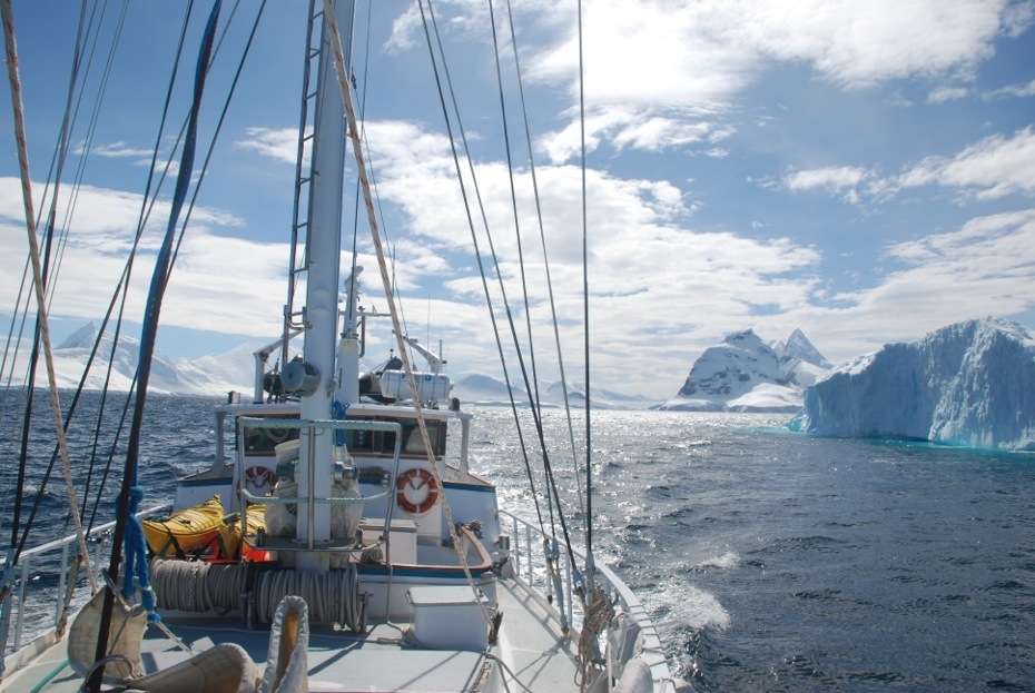 Sailboat with ice in the Lemaire Channel, Antarctica