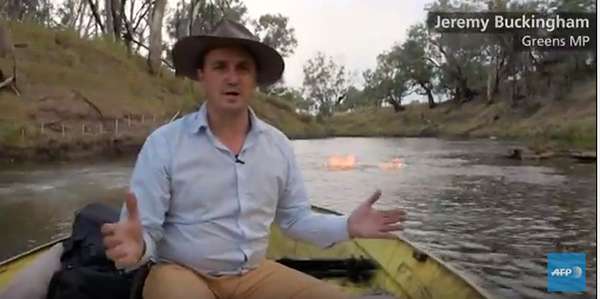 Australian Parliament member Jeremy Buckingham hopes his demonstration of how easily Queensland’s Condamine River can be set on fire will prompt a moratorium on fracking until the methane source can be unequivocally determined. ©AFP News Agency, images from Max Phillips