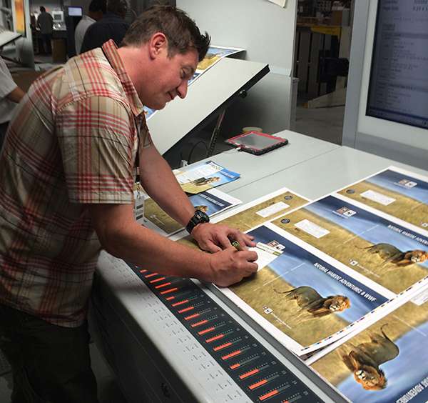 Creative Director Mark Hickey signs off on the 2017 catalog cover. Approved!
