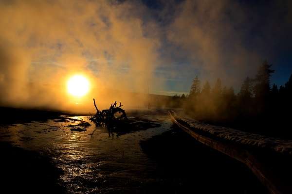 The mystical Fountain Paint Pots and Geyer Basin at sunset in Yellowstone National Park.
