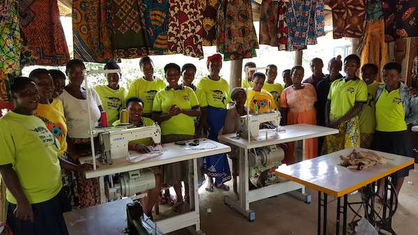 The women of Ride 4 A Woman enjoying their new sewing machines donated by Natural Habitat Adventures.