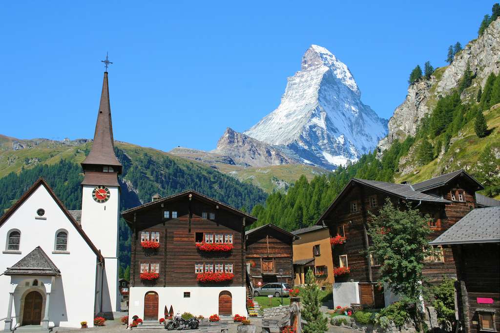 Nestled into the valley, Zermatt is a jewel of the Swiss Alps. The Matterhorn rises above the small village.
