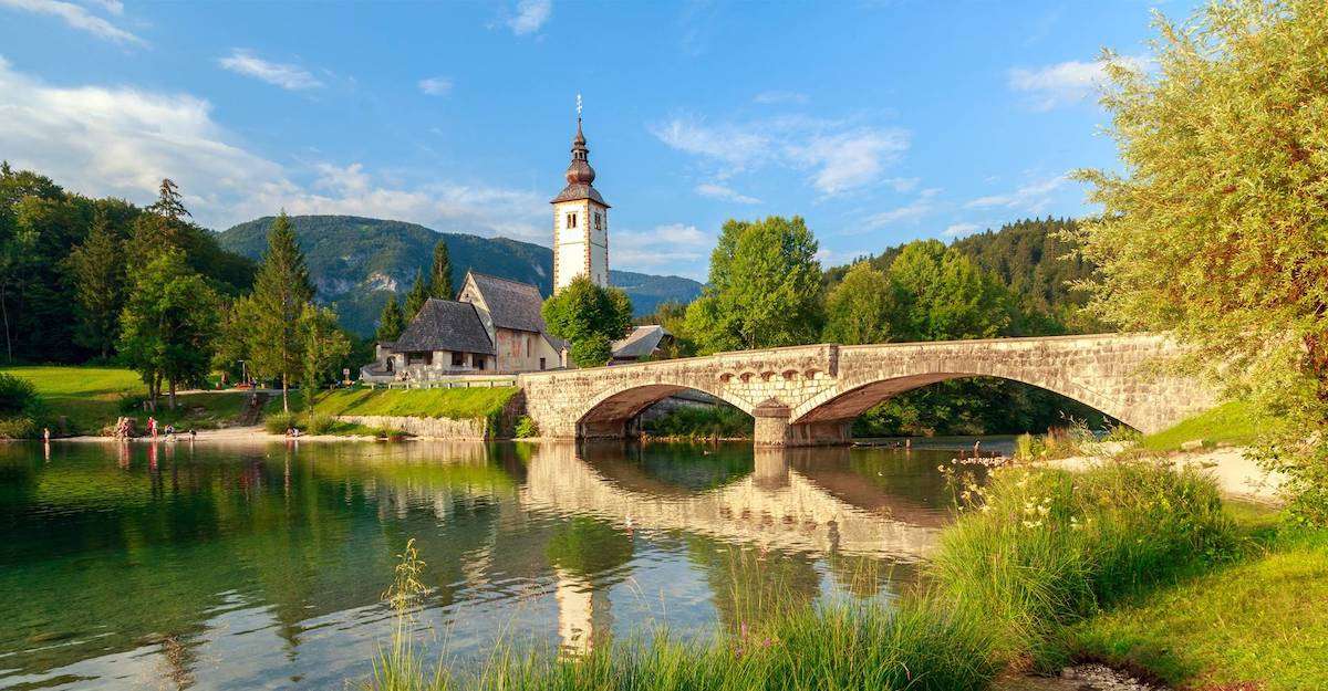 Church and a bridge by Lake Bohinj, Slovenia