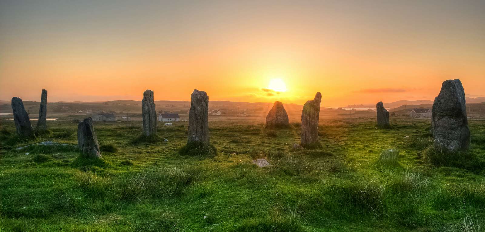 Sunset over the Callanish 2, circle of standing stones from 4000 BC on the Isle of Lewis, Outer Hebrides, Scotland