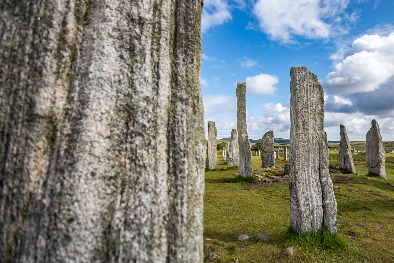 Callanish standing stones, with one blurred stone in the foreground. Isle od Lewis, Outer Hebrides, Scotland.
