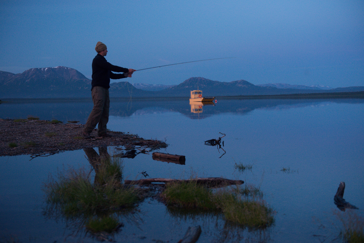 A man fishing in Sixmile Lake in Nondalton. Bristol Bay, Alaska, United States
