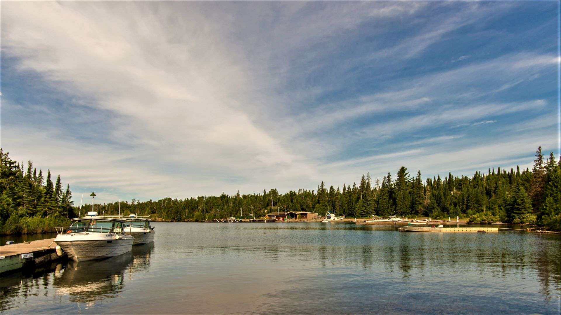 At Rock Harbor in Michigan's Isle Royale National Park, there are a few small boats anchored..