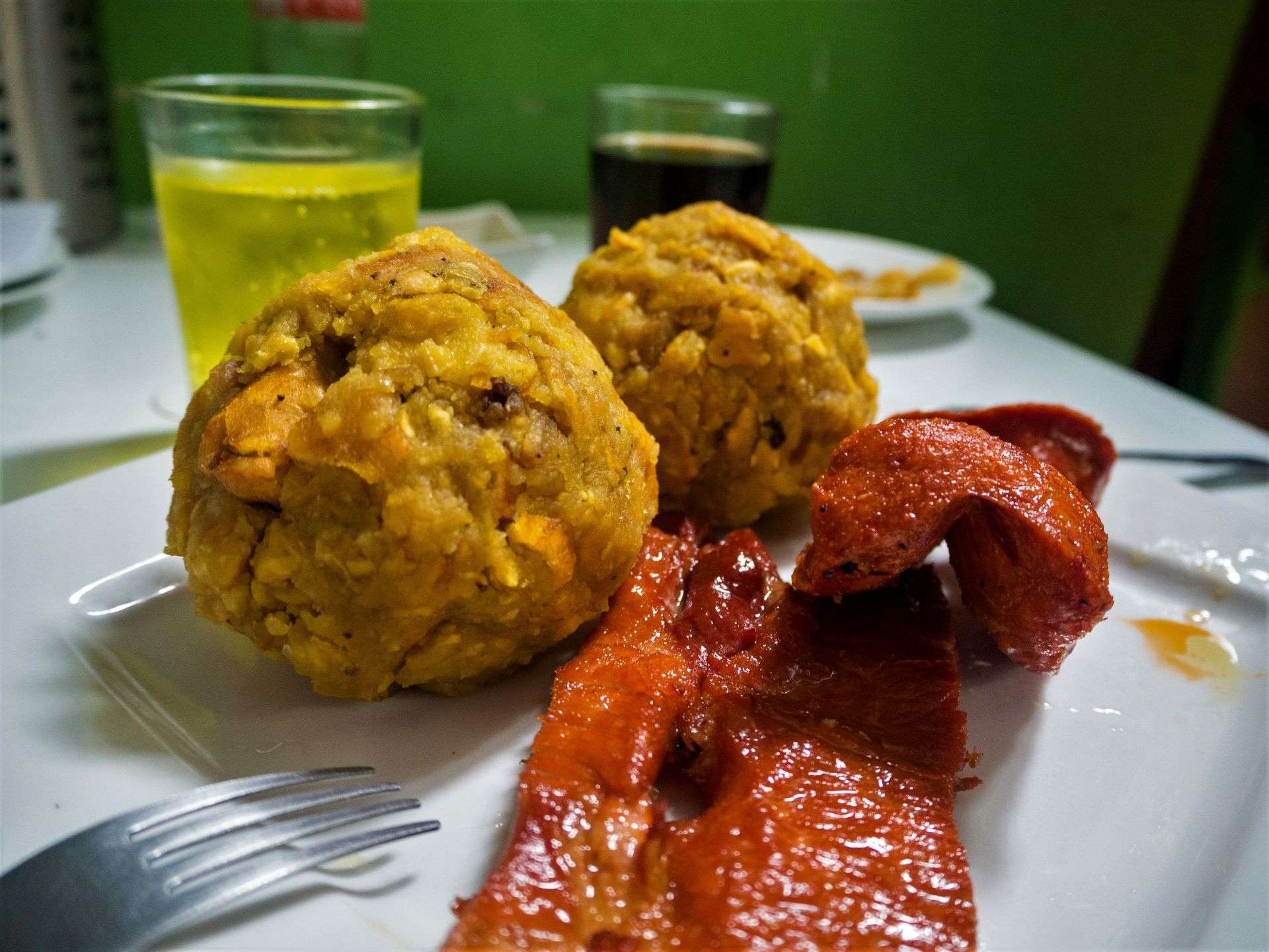 Smoked cecina with tacacho and patacones.