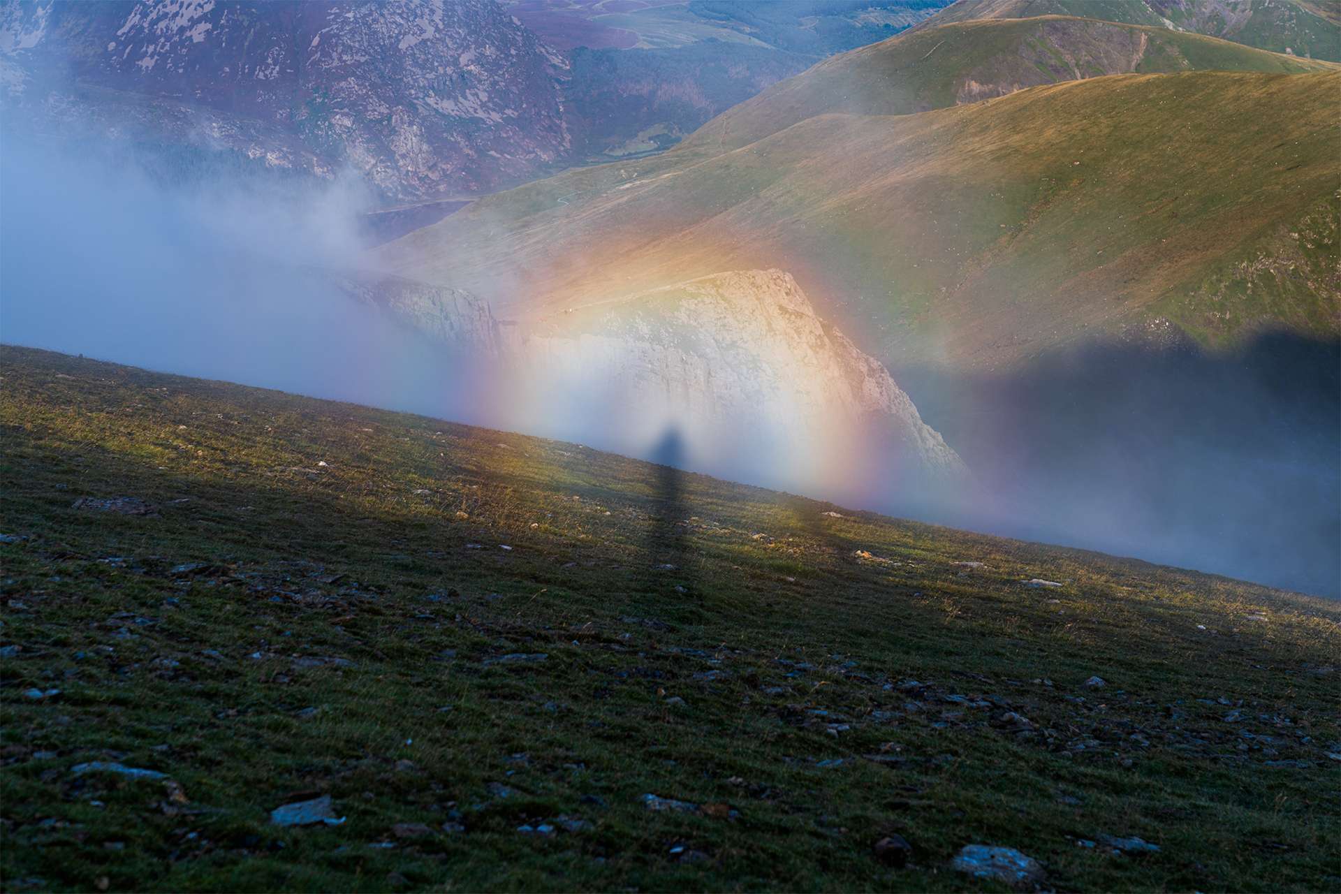 brocken spectre green rolling rocky hills