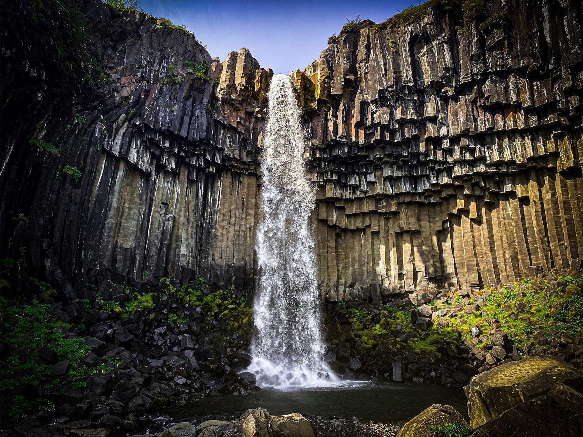 Basalt pillar waterfall Basalt columns at Svartifoss waterfall