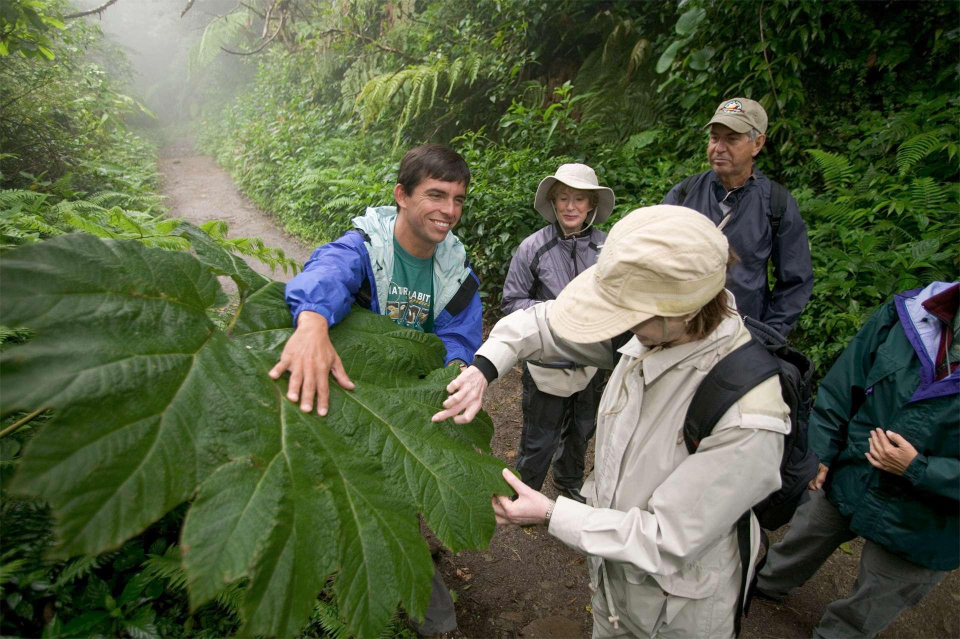Nat Hab Expedition Leader teaching travelers about rain forest species in Costa Rica