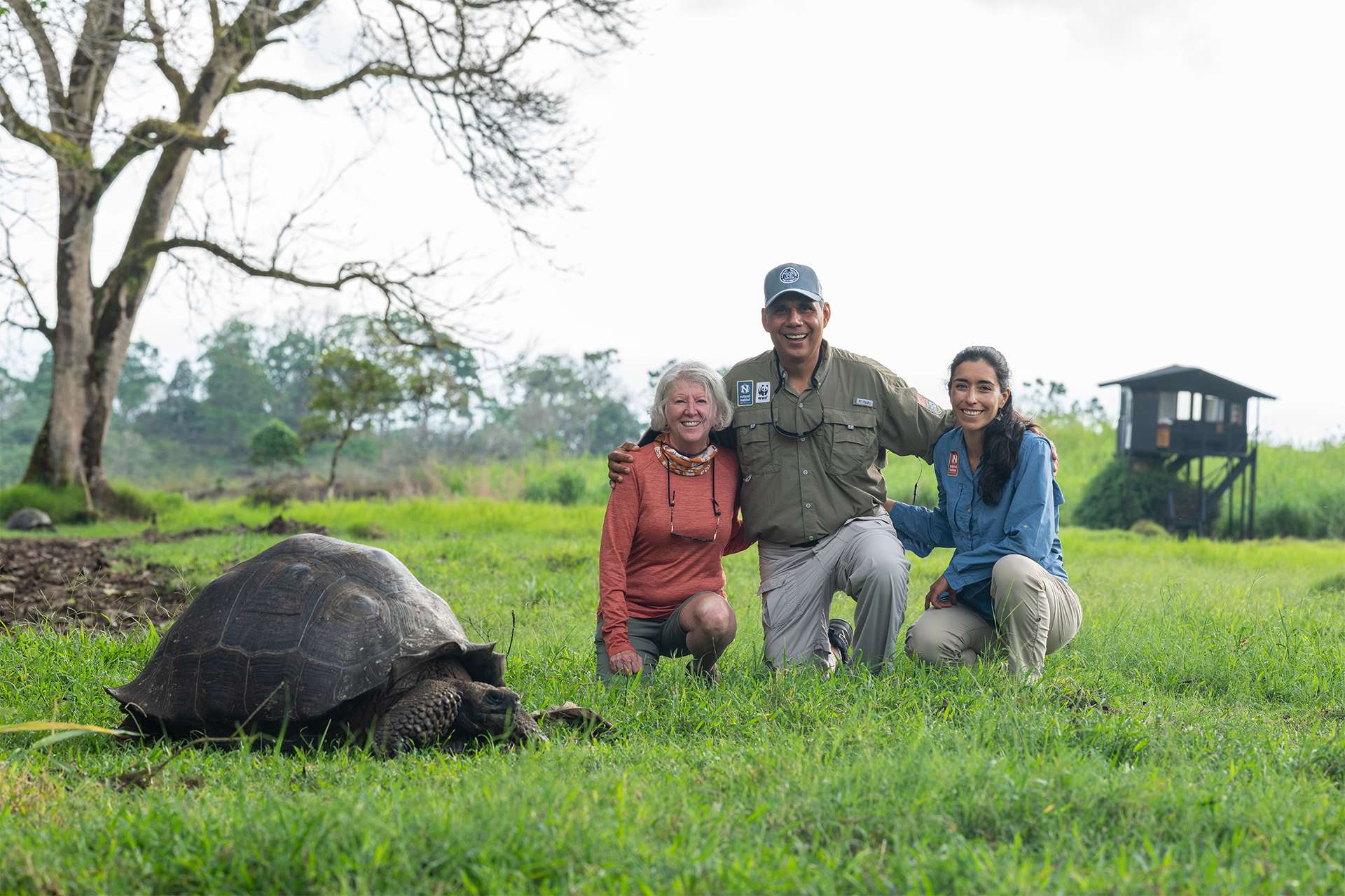 Travelers and wildlife guides expedition leaders in Galápagos Islands giant tortoise island
