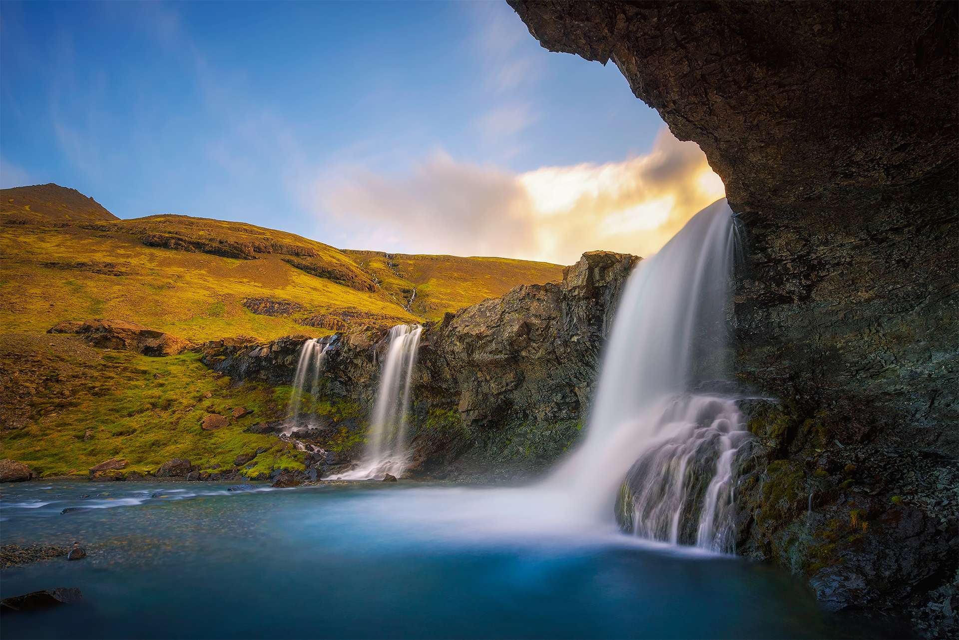 Skutafoss waterfalls near Hofn in Iceland photographed from a cave. Long exposure.