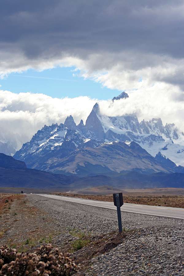 Road sign and peaks in Patagonia