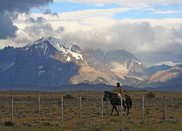 Woman riding horse in Patagonia