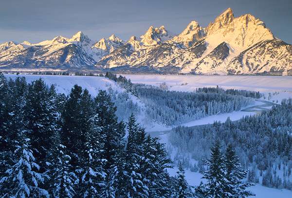 Unencumbered by foothills, the Teton Range has magnificent peaks that stand nearly 7,000 feet above the valley floor. Especially in winter, they provide one of the most impressive and soul-stirring views in the Rockies. ©Henry H. Holdsworth