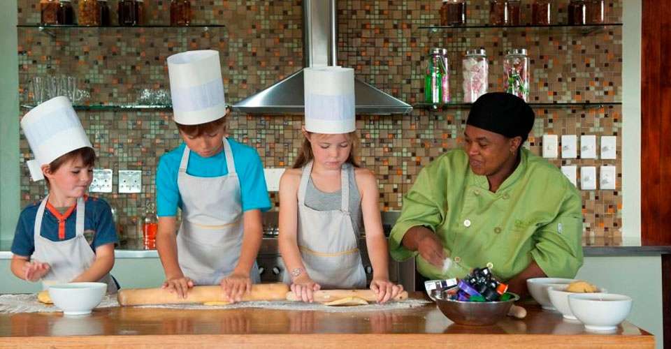 Local chef and children, Kwandwe Private Game Reserve, South Africa.