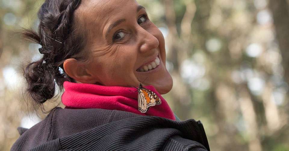 Nat Hab guest and monarch butterfly, El Rosario Butterfly Sanctuary, Angangueo, Mexico.
