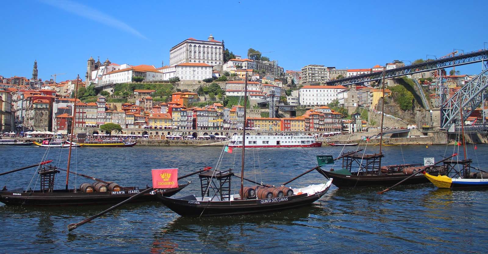 Boats and wine barrels, Luis I Bridge, Porto, Portugal.
