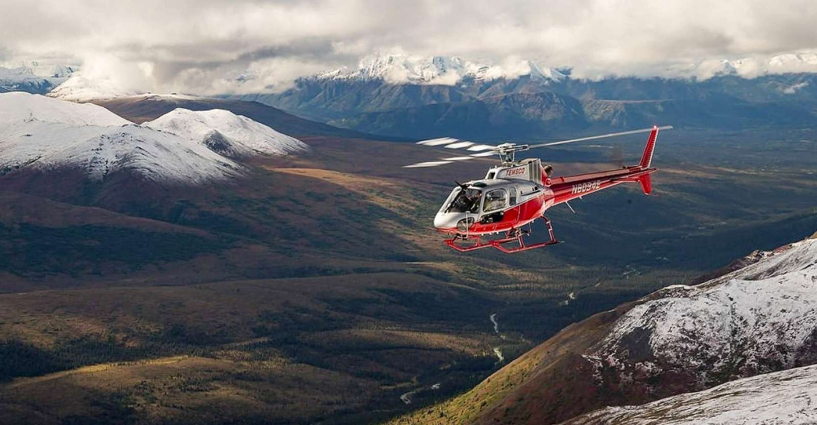 Private helicopter flying to Denali Backcountry Lodge, Denali National Park & Preserve, Alaska.